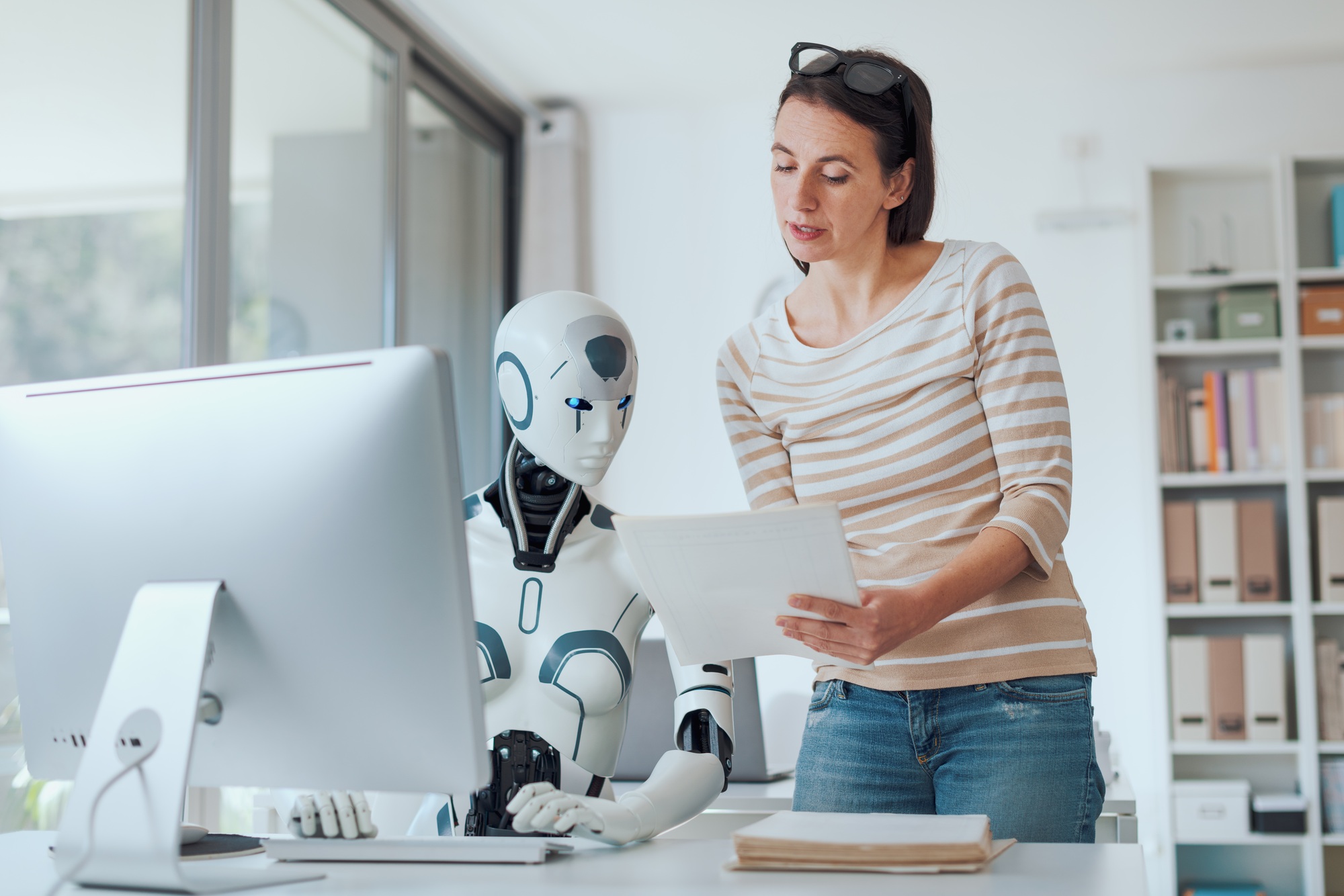 Woman and AI robot working together